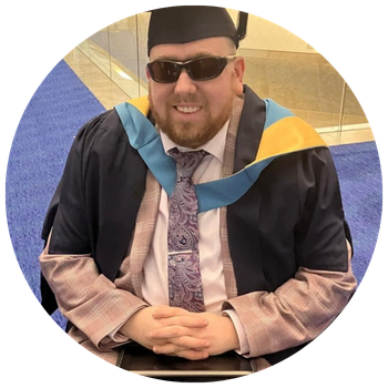 Oliver in his cap and gown at his graduation.