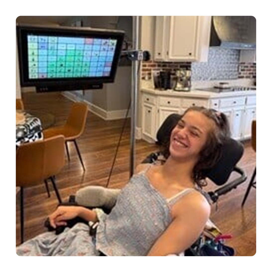 Trinity Joy at home using her Grid Pad and eye gaze