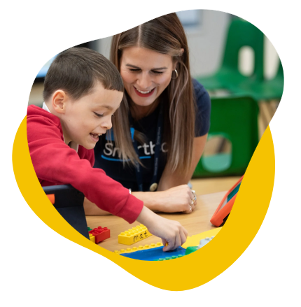 An AT Specialist using AAC with a student