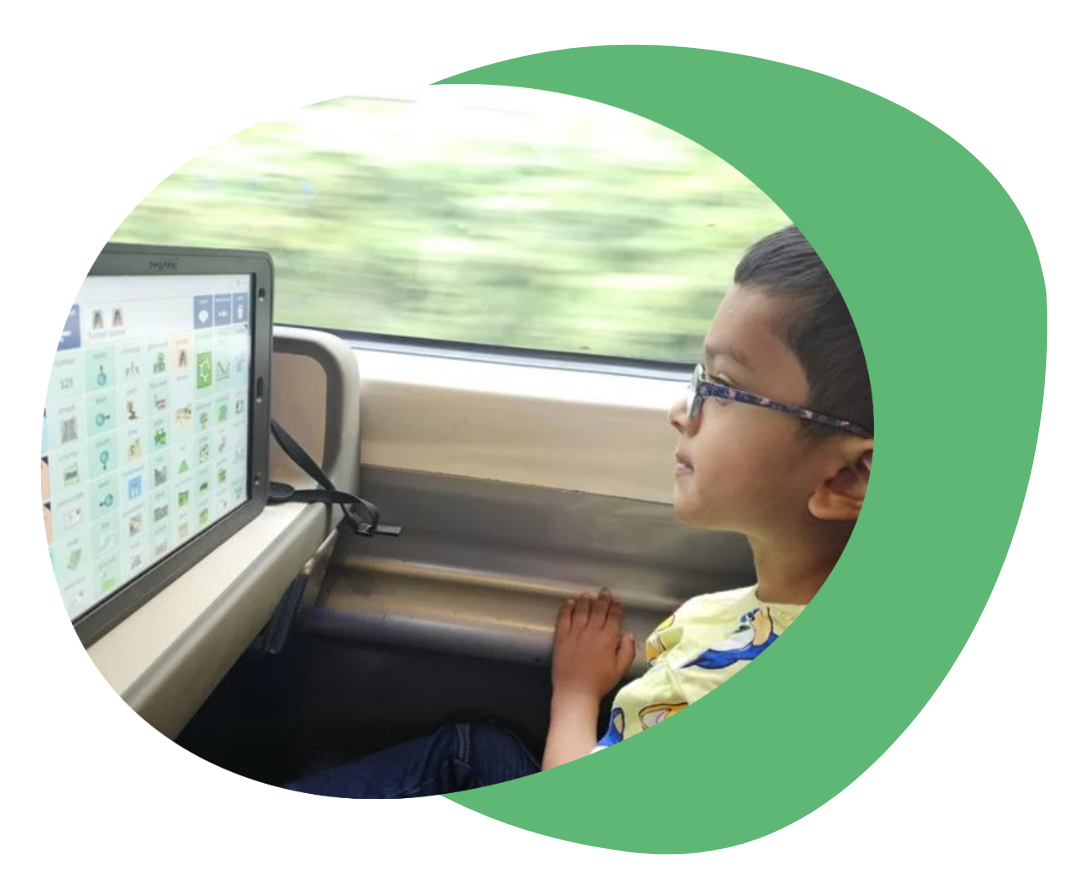 Asher using Grid for iPad on the train.