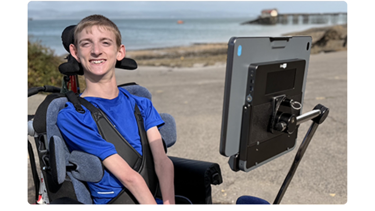 Samuel smiling with his Evo at the beach