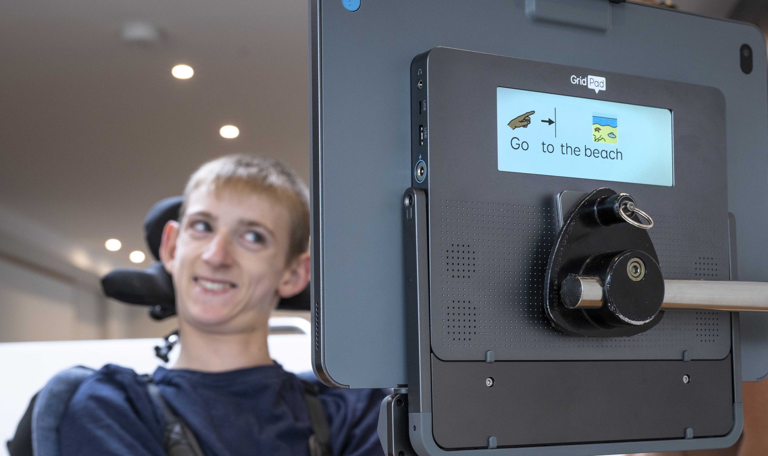 One point calibration - Samuel using his Grid Pad with Evo. The partner screen is showing the words and symbols for 'go to the beach.'