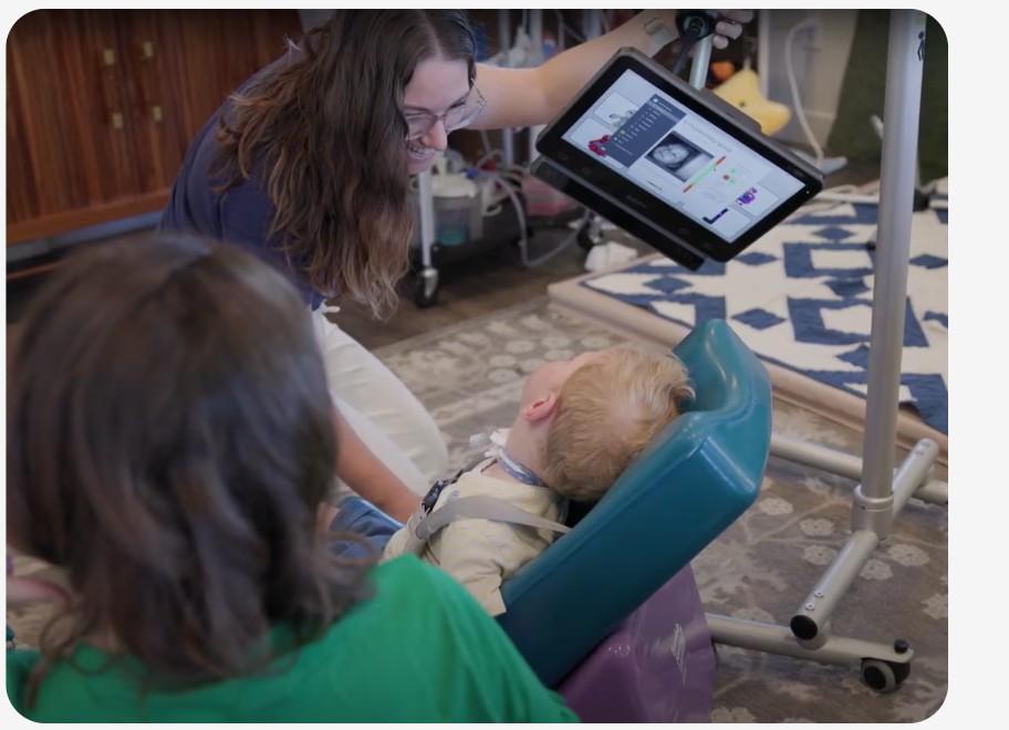 Jack interacting with his care giver using his Grid Pad 13