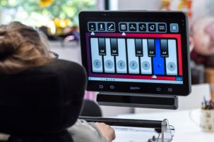 Milly using Look software on her Grid Pad 16 using her Vida eye trcaker