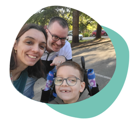 Nael taking a selfie with his mother and father.