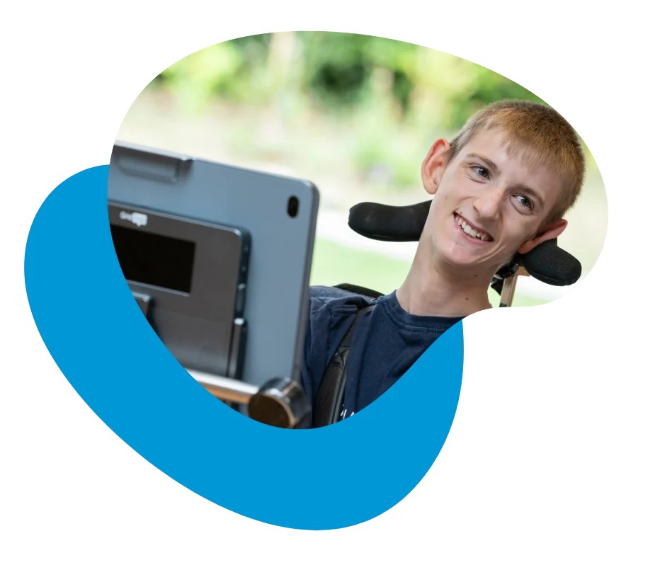 Samuel smiling with his Grid Pad 16 and Evo